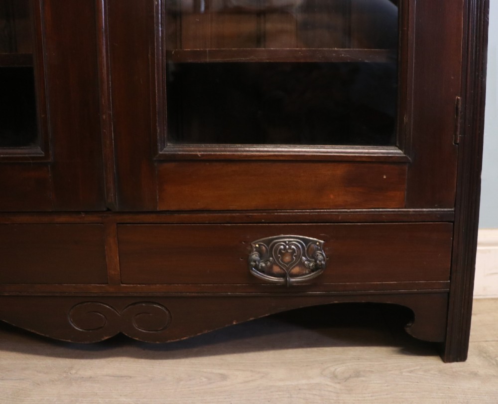 A late Victorian mahogany bookcase or display cabinet, later hand sign written for Fry’s cocoa and chocolate.  View XXI