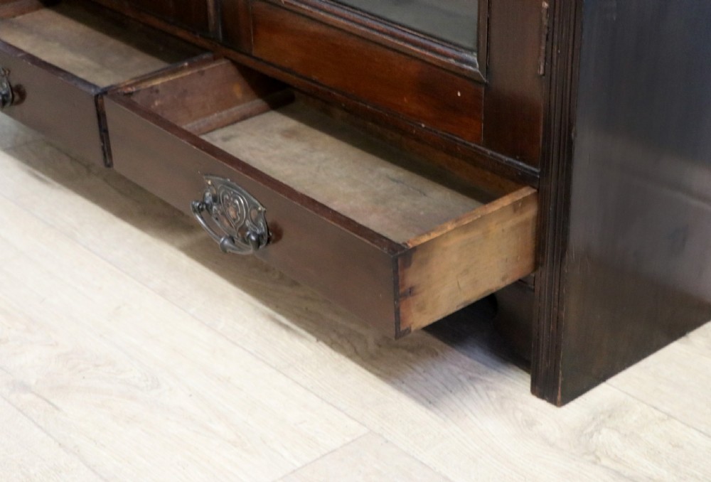 A late Victorian mahogany bookcase or display cabinet, later hand sign written for Fry’s cocoa and chocolate.  View XXIII