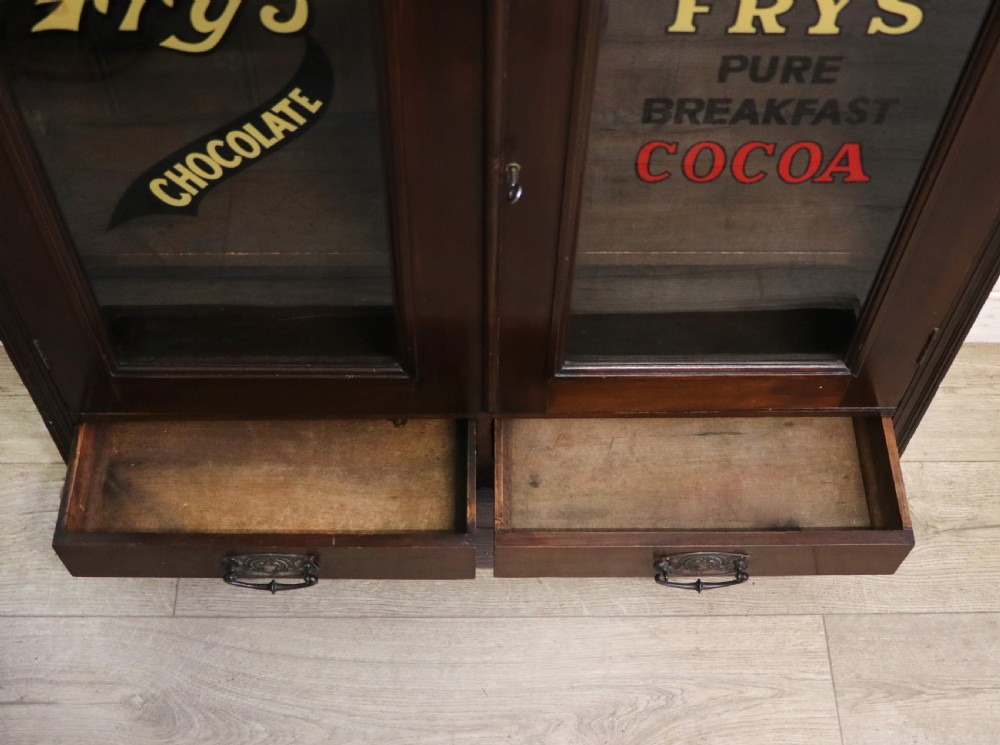 A late Victorian mahogany bookcase or display cabinet, later hand sign written for Fry’s cocoa and chocolate.  View XXV