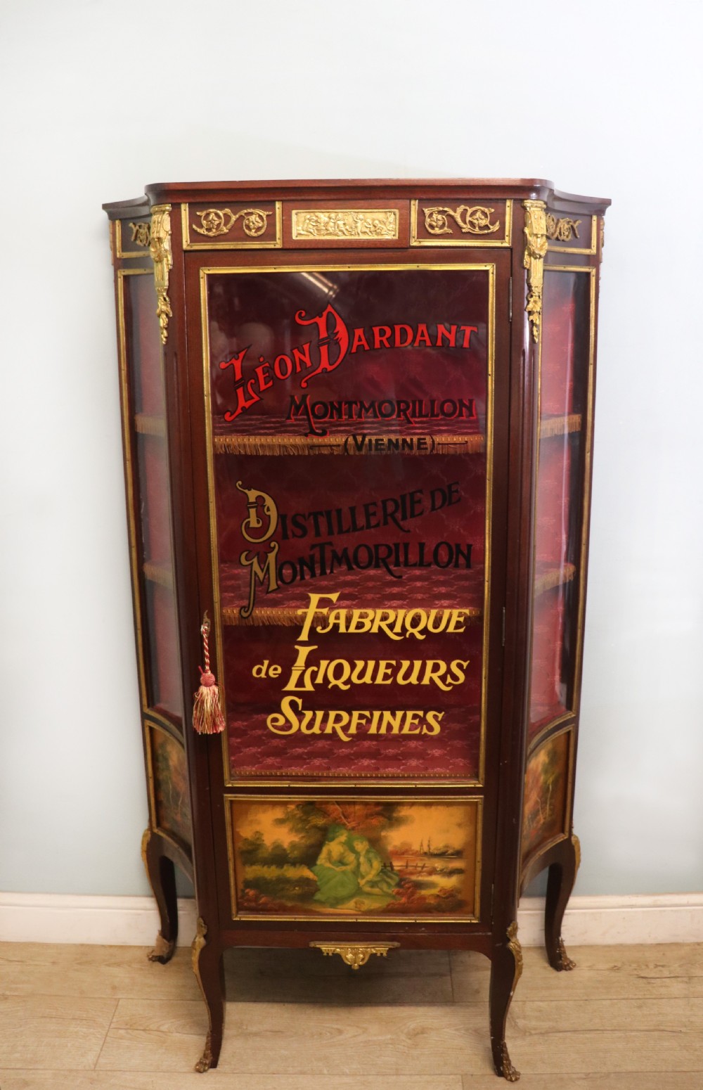 A very fine 20th century Vernis Martin style vitrine display cabinet, later sign written for Leon Dardant distillery of Vienna.