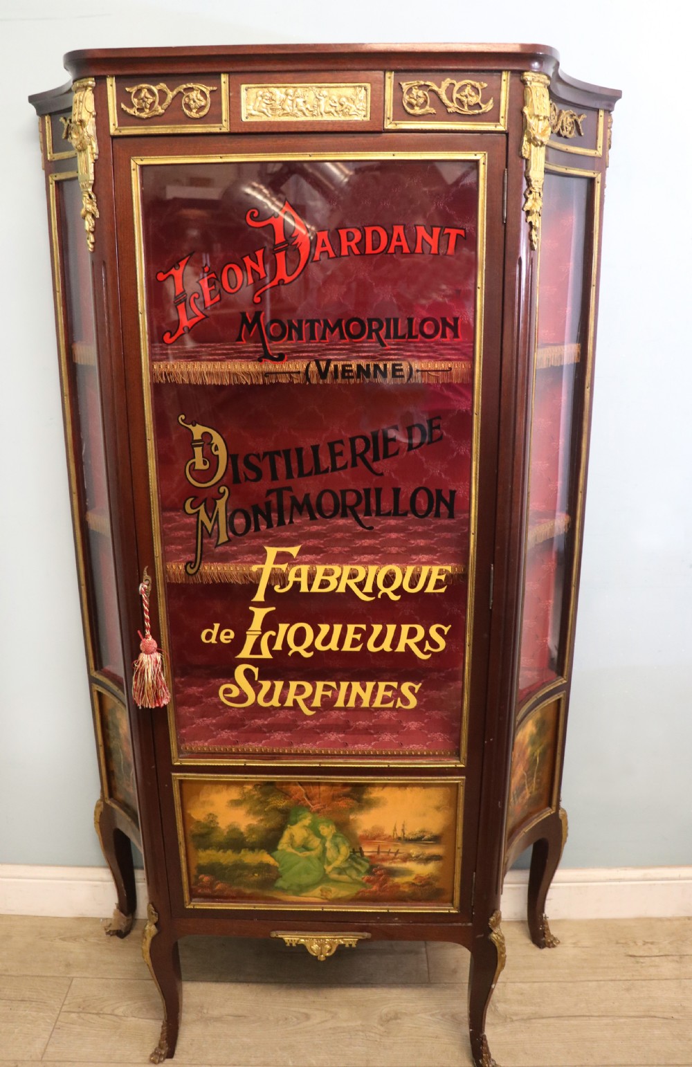 A very fine 20th century Vernis Martin style vitrine display cabinet, later sign written for Leon Dardant distillery of Vienna. View II