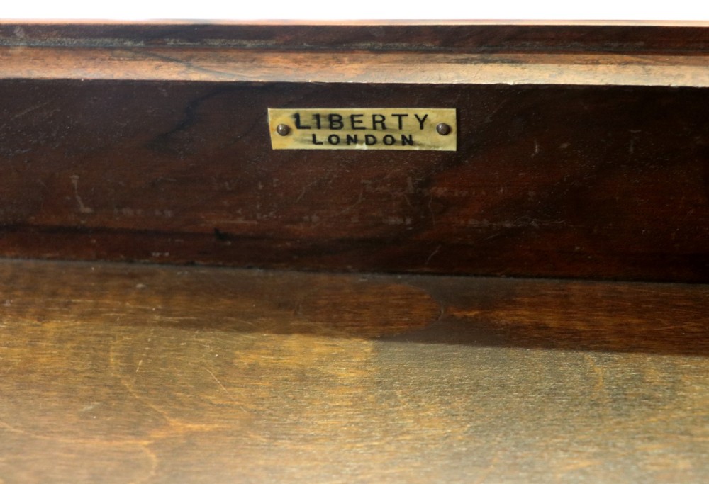 A lovely late 19th century mahogany side table, that retailers’ original label for Liberty of London. View IX