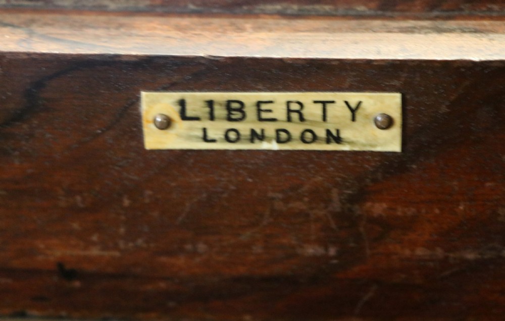 A lovely late 19th century mahogany side table, that retailers’ original label for Liberty of London. View XVII
