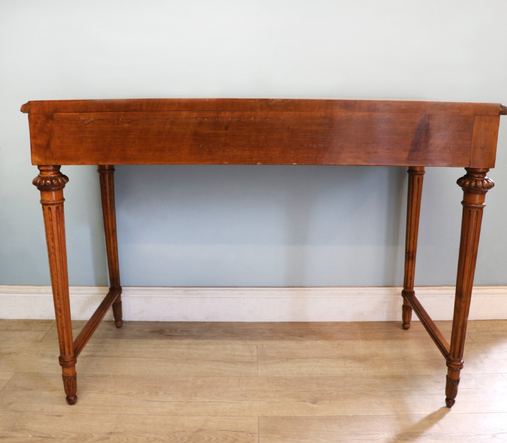 A lovely late 19th century mahogany side table, that retailers’ original label for Liberty of London. View XVIII