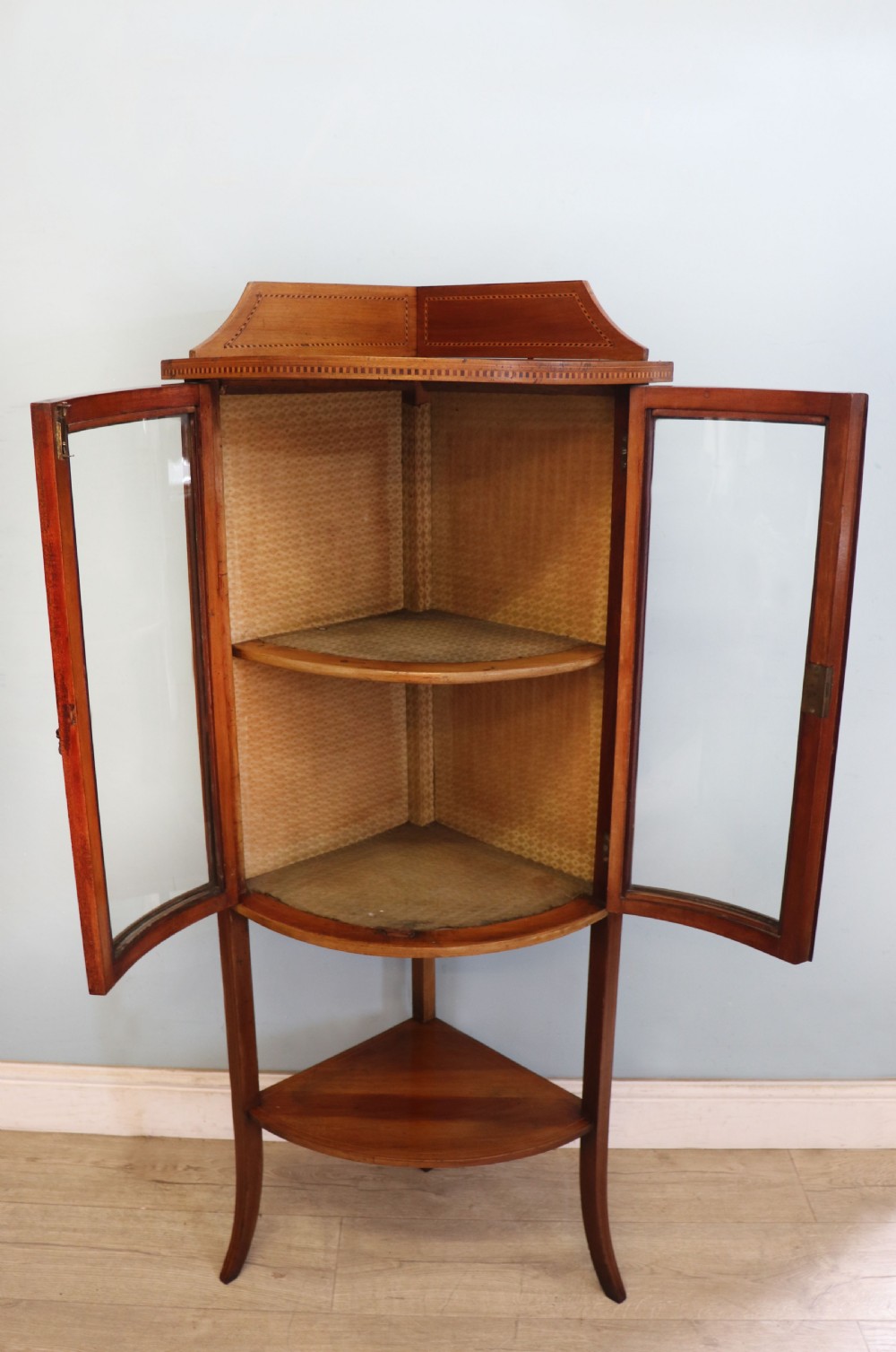  A lovely small Edwardian mahogany and inlaid corner display cabinet.  View III