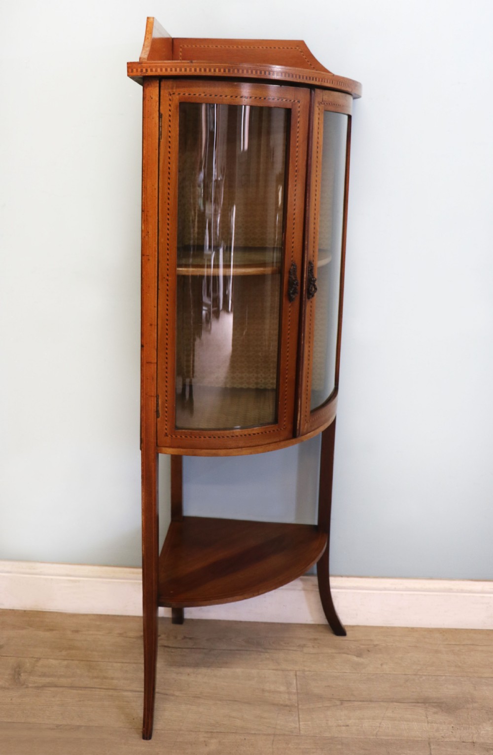  A lovely small Edwardian mahogany and inlaid corner display cabinet.  View VII