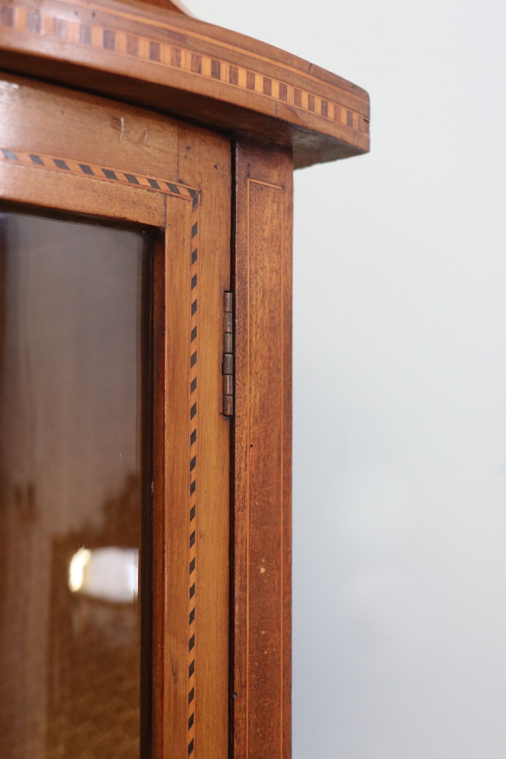  A lovely small Edwardian mahogany and inlaid corner display cabinet.  View XI