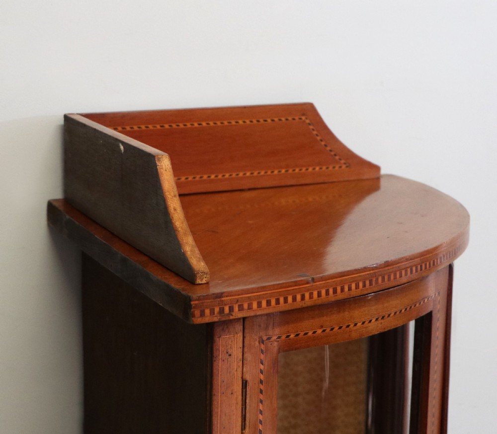  A lovely small Edwardian mahogany and inlaid corner display cabinet.  View XII