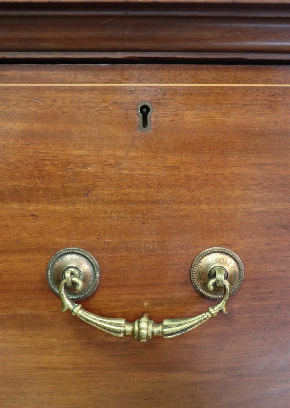 A lovely early 20th century, beautifully made mahogany chest of drawers. View XI