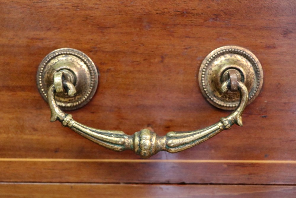 A lovely early 20th century, beautifully made mahogany chest of drawers. View XIV