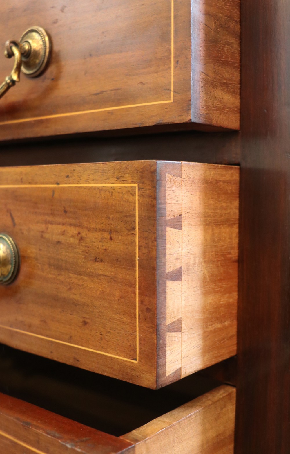 A lovely early 20th century, beautifully made mahogany chest of drawers. View XVII
