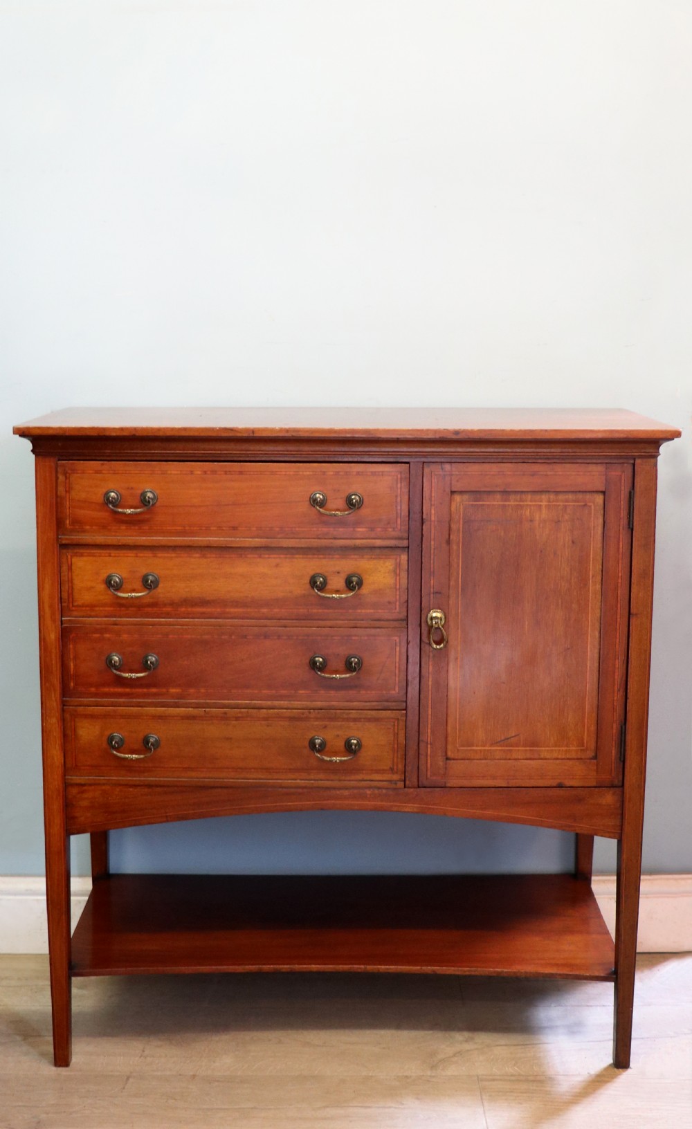 A wonderful early 20th century mahogany and inlaid combination music cabinet and cupboard.