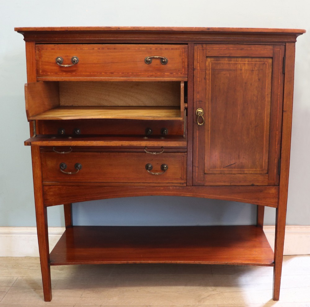 A wonderful early 20th century mahogany and inlaid combination music cabinet and cupboard. View IV