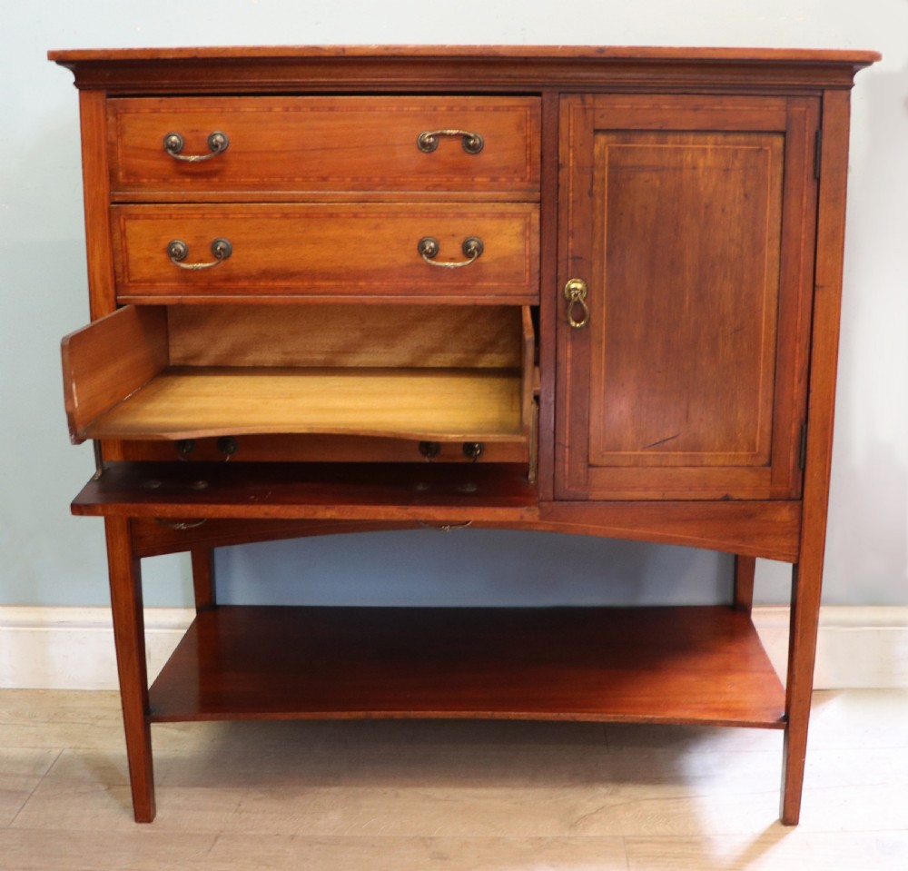 A wonderful early 20th century mahogany and inlaid combination music cabinet and cupboard. View V