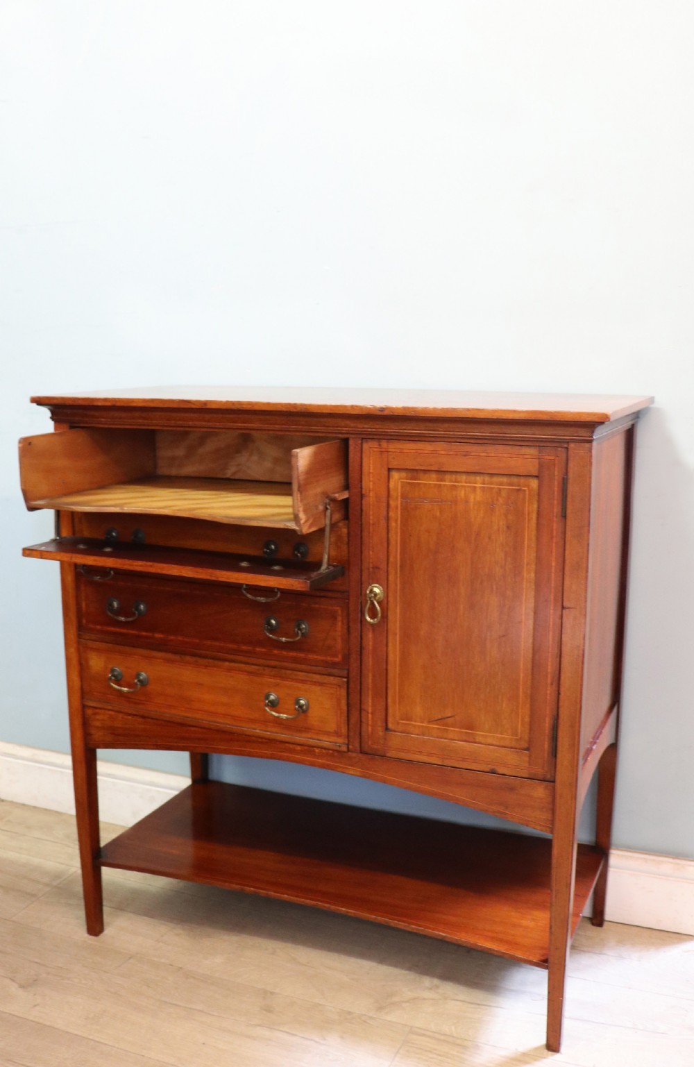 A wonderful early 20th century mahogany and inlaid combination music cabinet and cupboard. View X