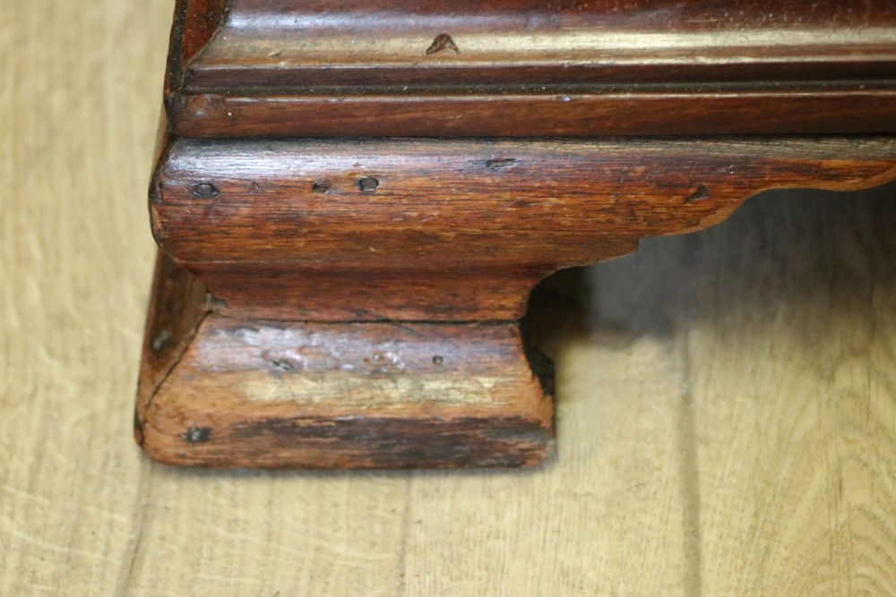 A Georgian Revival mahogany chest of drawers featuring two short drawers over three long drawers with decorative inlay and brass handles. View XVI