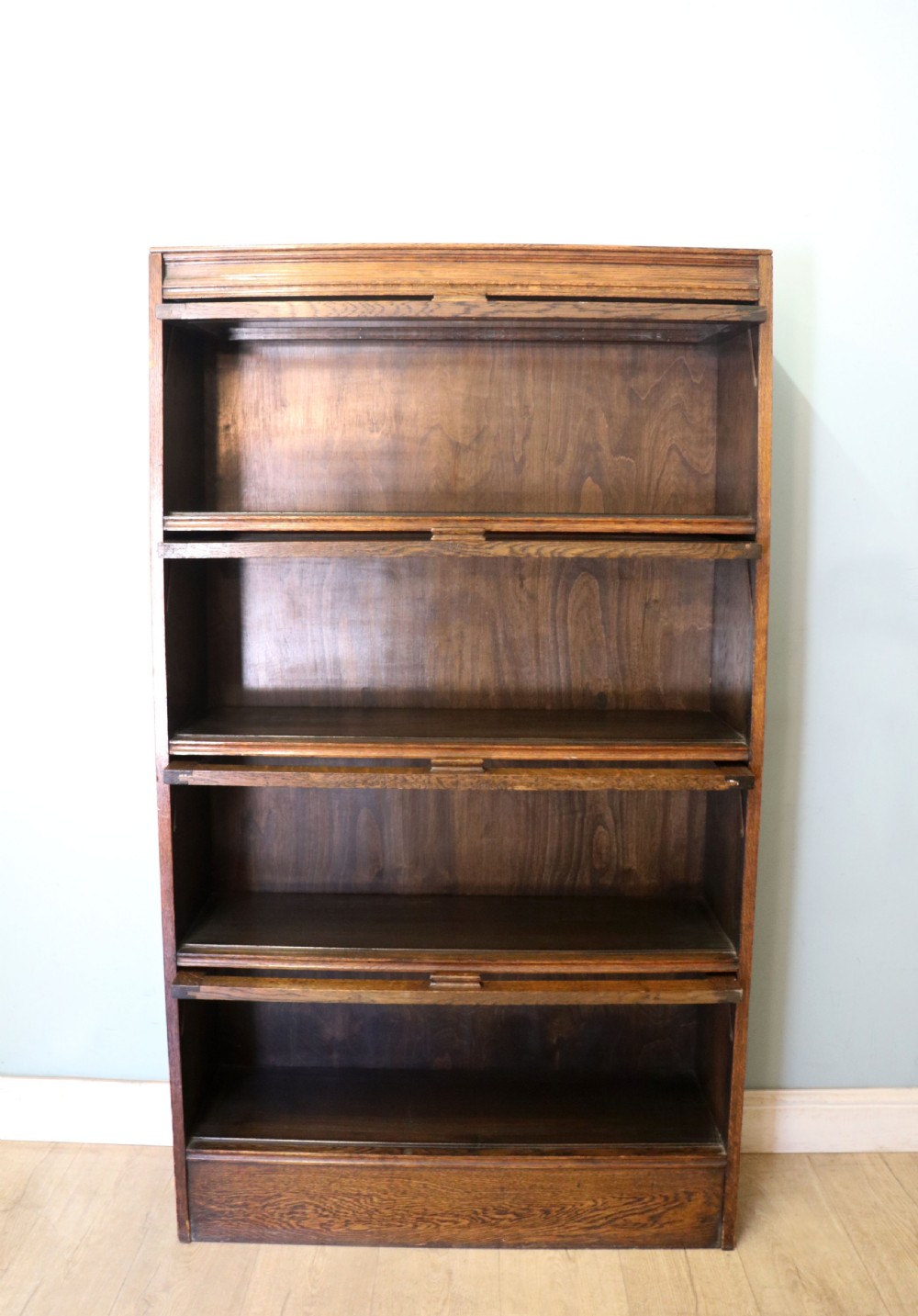 A quality barristers style bookcase dating to the early 20th century.  View II