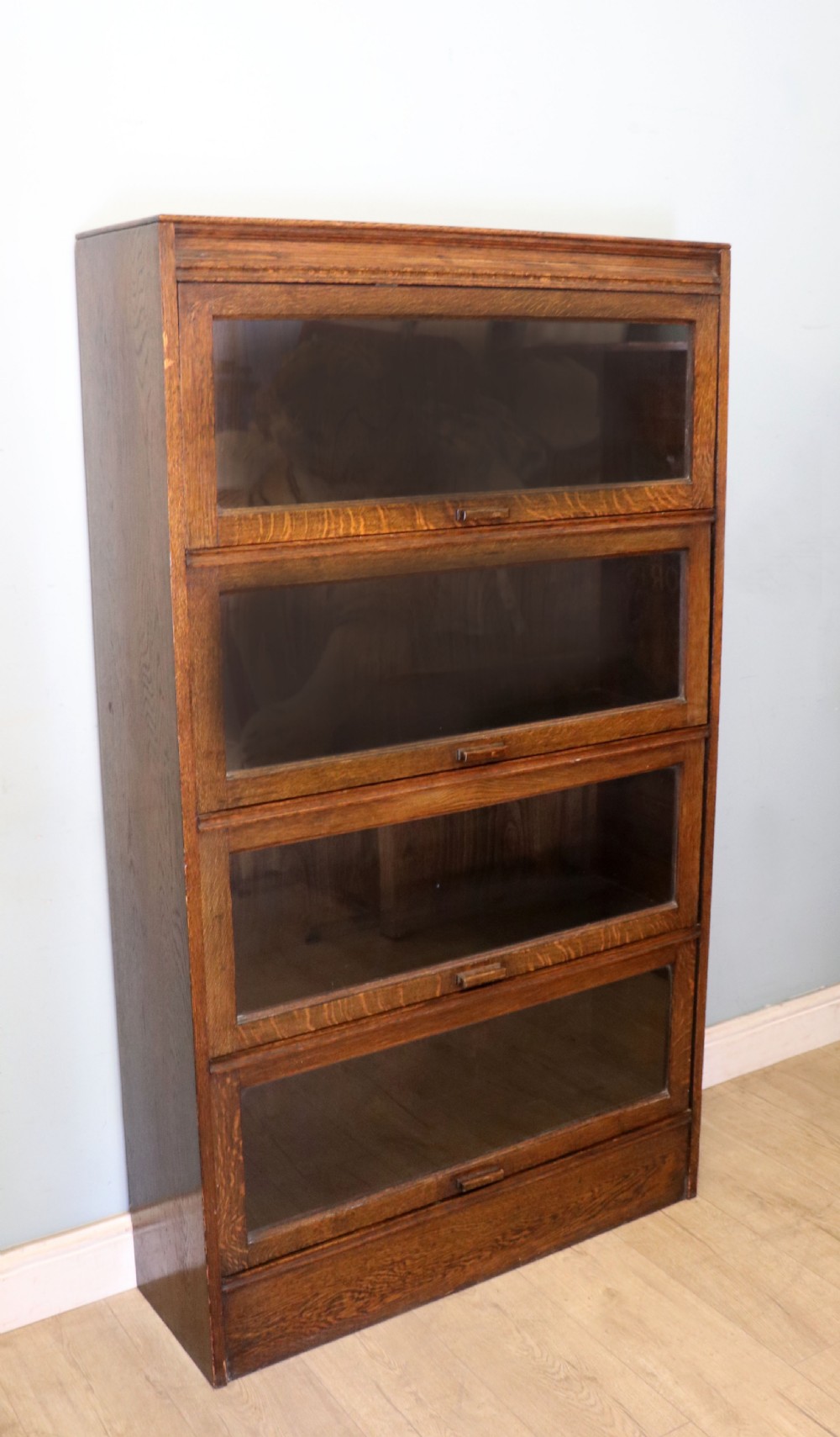 A quality barristers style bookcase dating to the early 20th century.  View III