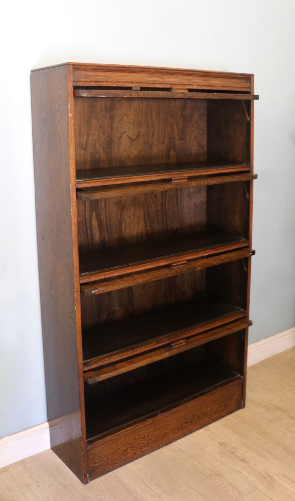 A quality barristers style bookcase dating to the early 20th century.  View IV