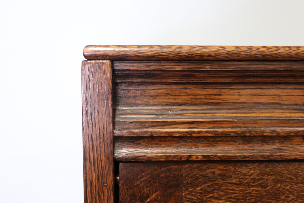 A quality barristers style bookcase dating to the early 20th century.  View V
