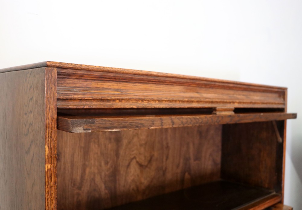 A quality barristers style bookcase dating to the early 20th century.  View VI