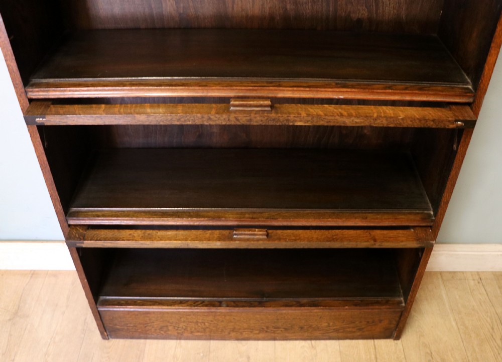 A quality barristers style bookcase dating to the early 20th century.  View XI