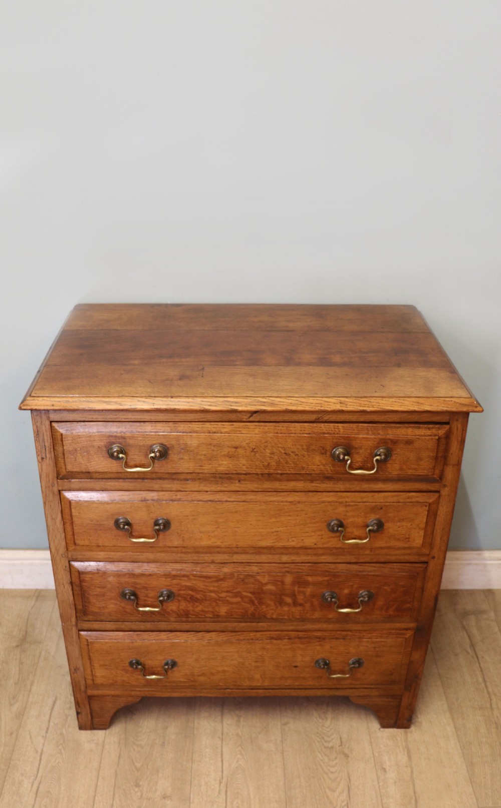 A 19th century or possibly earlier, diminutive Oak chest of four drawers.  View II