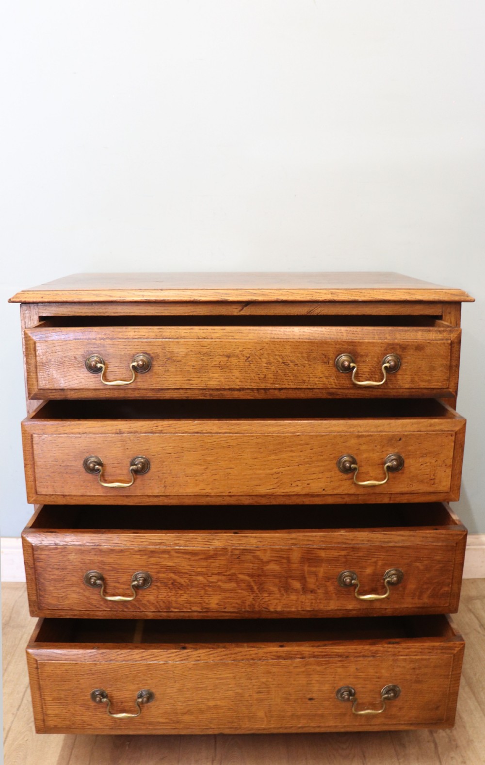 A 19th century or possibly earlier, diminutive Oak chest of four drawers.  View III