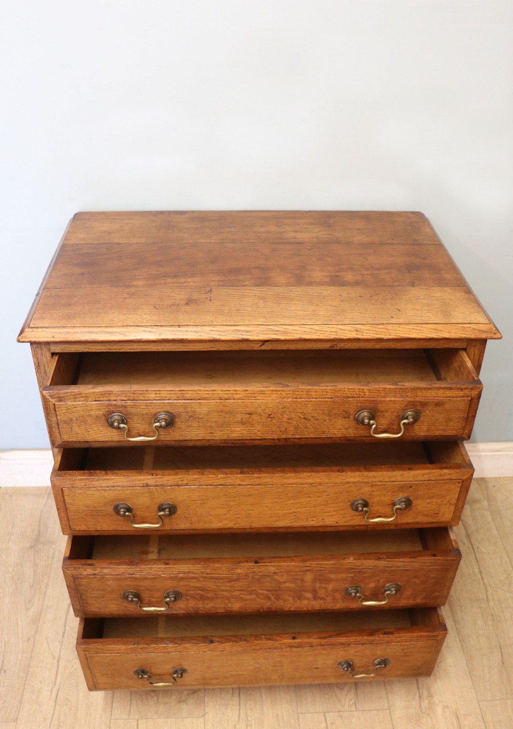 A 19th century or possibly earlier, diminutive Oak chest of four drawers.  View IV