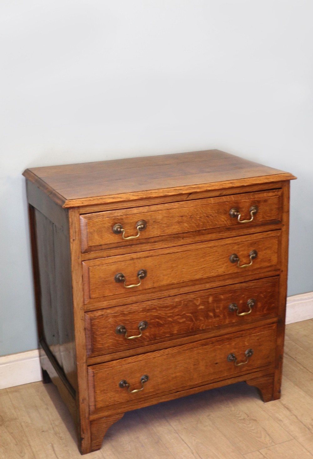 A 19th century or possibly earlier, diminutive Oak chest of four drawers.  View V
