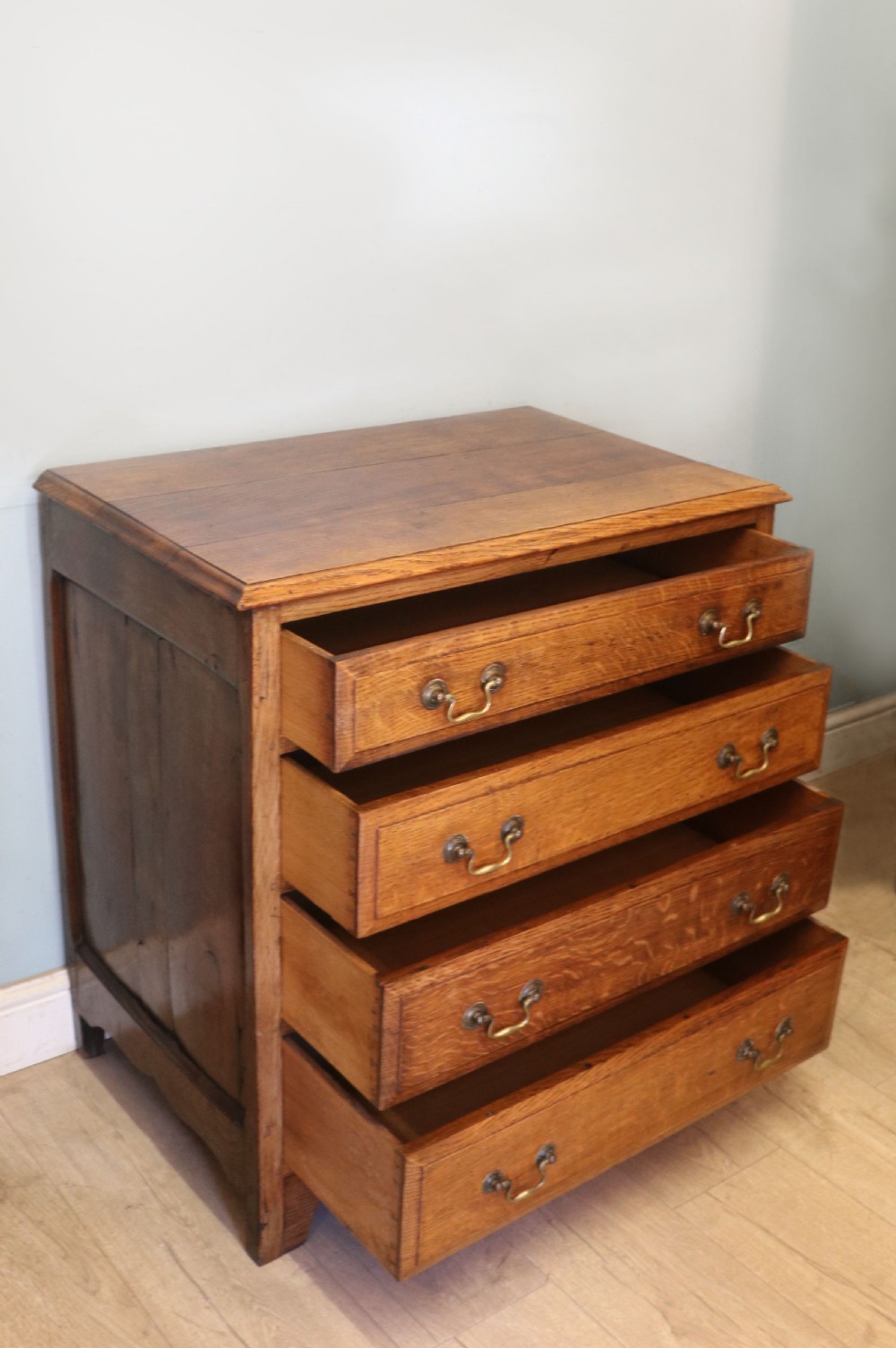 A 19th century or possibly earlier, diminutive Oak chest of four drawers.  View VI