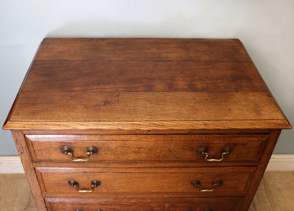 A 19th century or possibly earlier, diminutive Oak chest of four drawers.  View VII