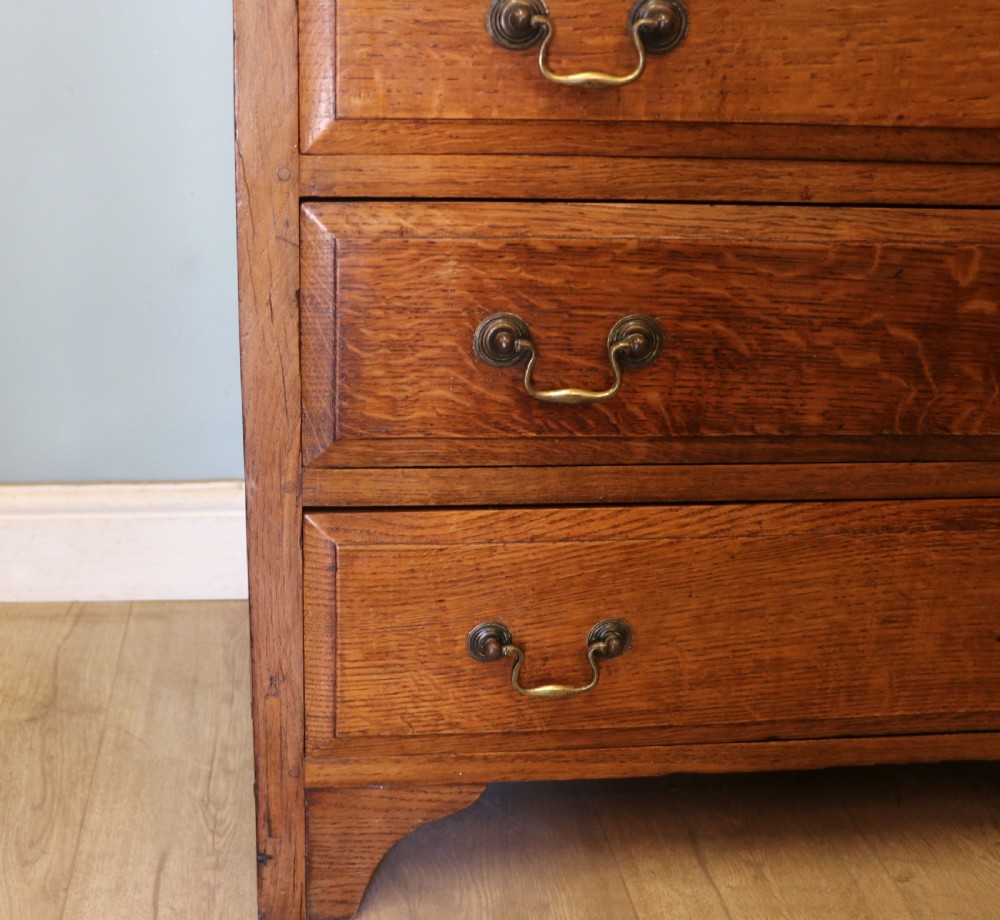 A 19th century or possibly earlier, diminutive Oak chest of four drawers.  View X