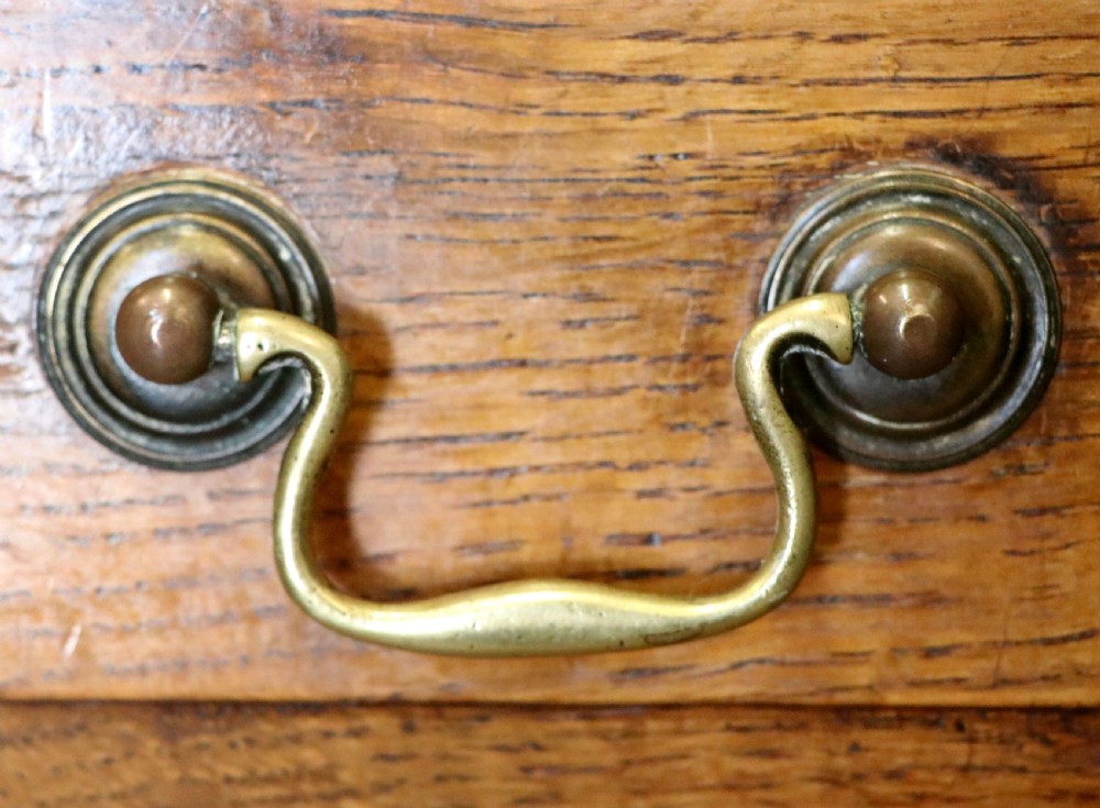 A 19th century or possibly earlier, diminutive Oak chest of four drawers.  View XI