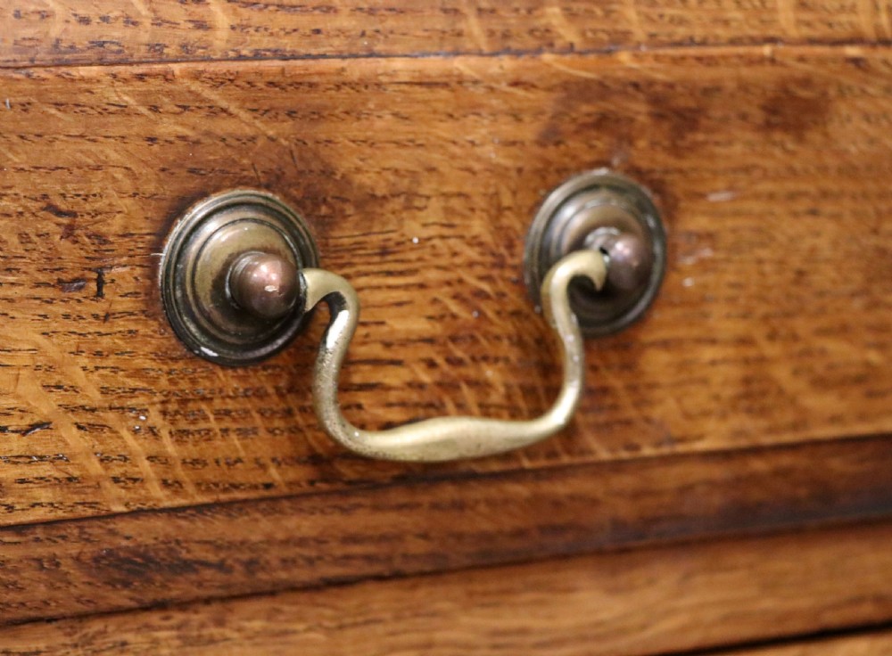 A 19th century or possibly earlier, diminutive Oak chest of four drawers.  View XII