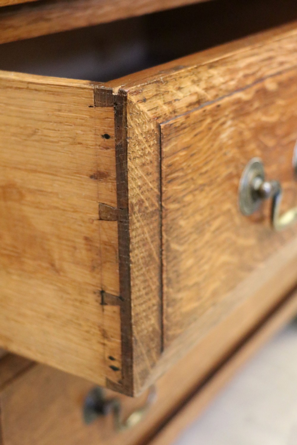 A 19th century or possibly earlier, diminutive Oak chest of four drawers.  View XIII
