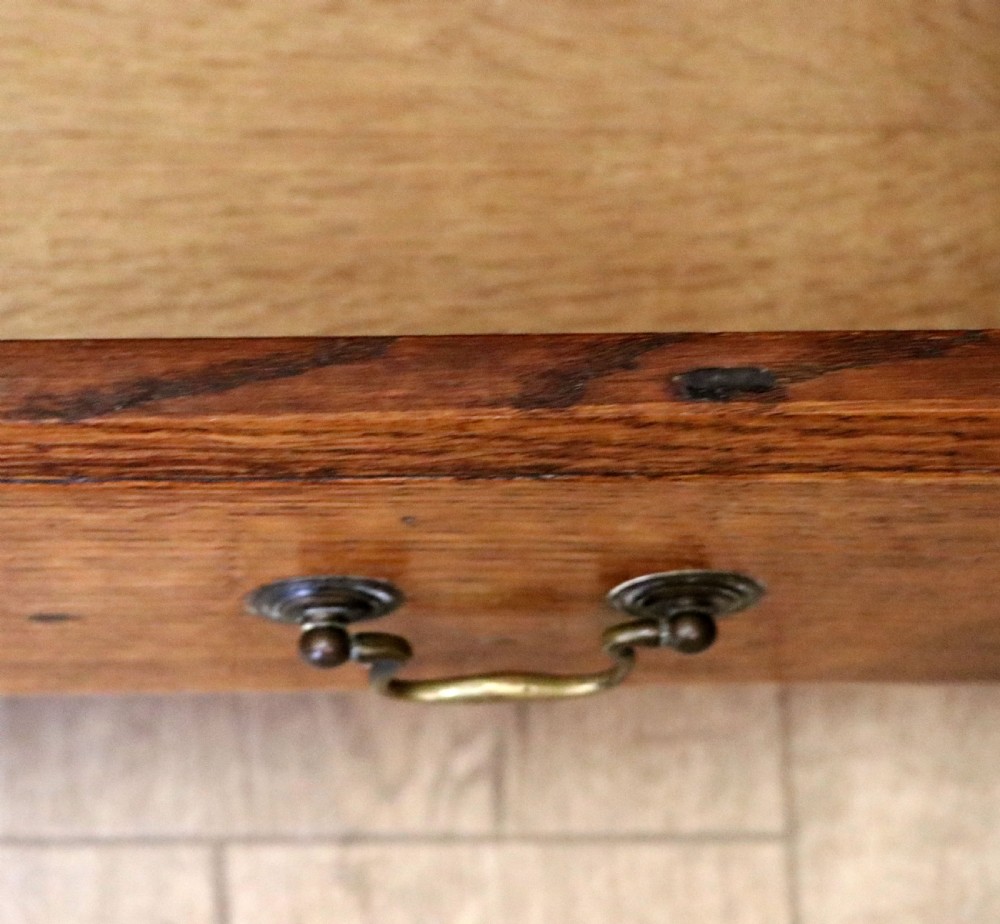 A 19th century or possibly earlier, diminutive Oak chest of four drawers.  View XIV