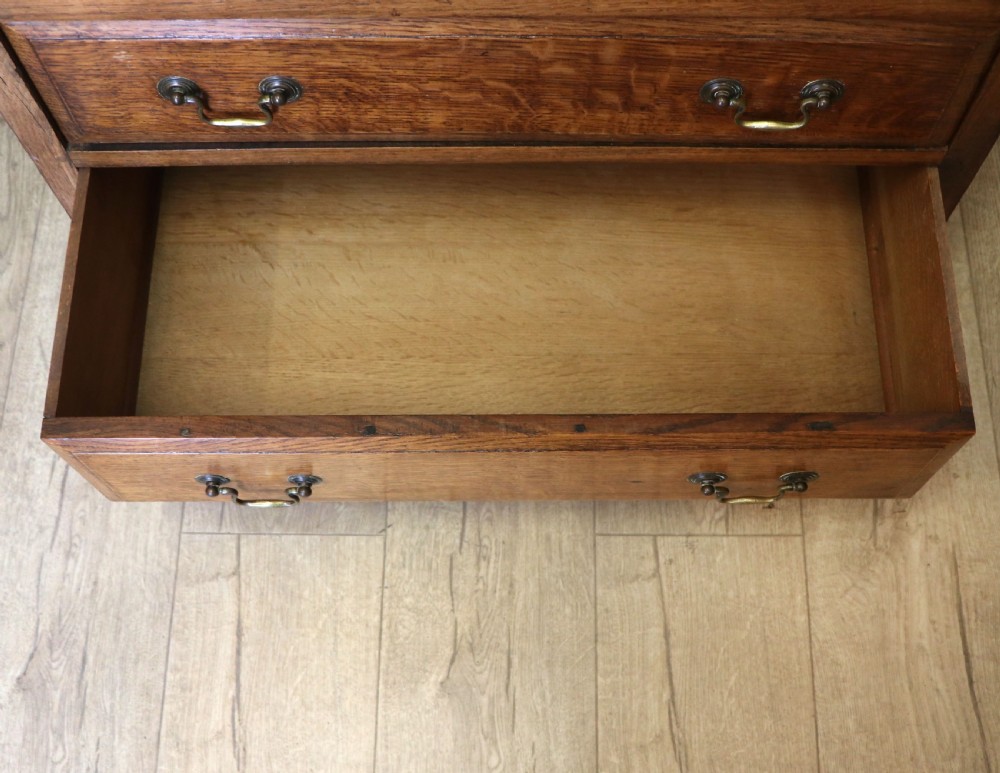 A 19th century or possibly earlier, diminutive Oak chest of four drawers.  View XV