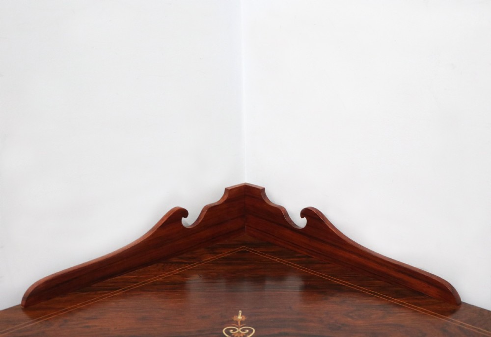 An early twentieth-century Sheraton Revival mahogany corner table featuring elaborate floral marquetry inlay, curved legs, and an undertier shelf. View VII