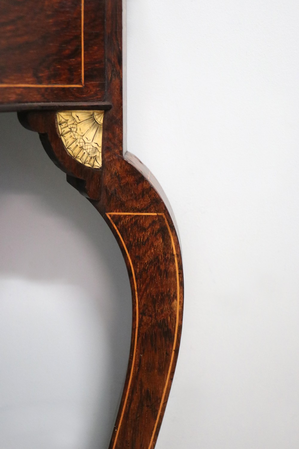 An early twentieth-century Sheraton Revival mahogany corner table featuring elaborate floral marquetry inlay, curved legs, and an undertier shelf. View XI
