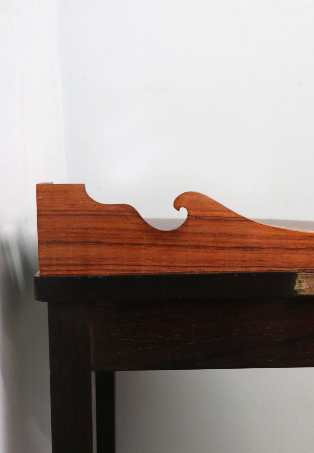 An early twentieth-century Sheraton Revival mahogany corner table featuring elaborate floral marquetry inlay, curved legs, and an undertier shelf. View XIII
