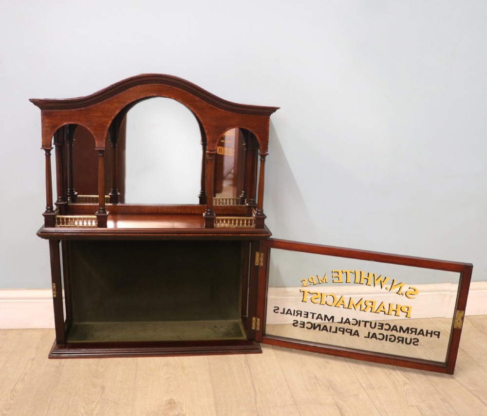 A stylish vintage apothecary cabinet by the renowned furniture makers Edwards & Roberts.  View IV