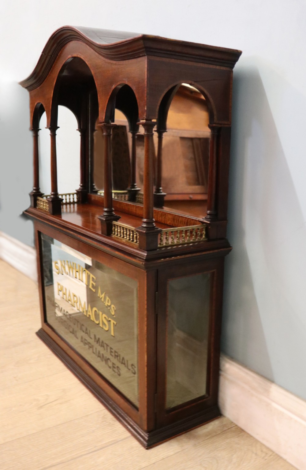 A stylish vintage apothecary cabinet by the renowned furniture makers Edwards & Roberts.  View VII