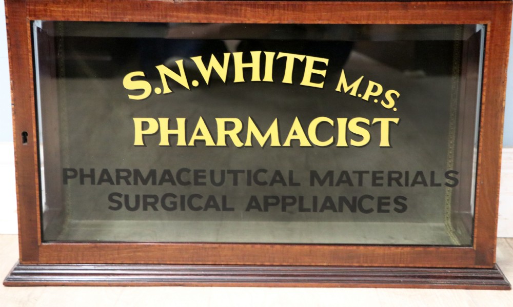 A stylish vintage apothecary cabinet by the renowned furniture makers Edwards & Roberts.  View XVII