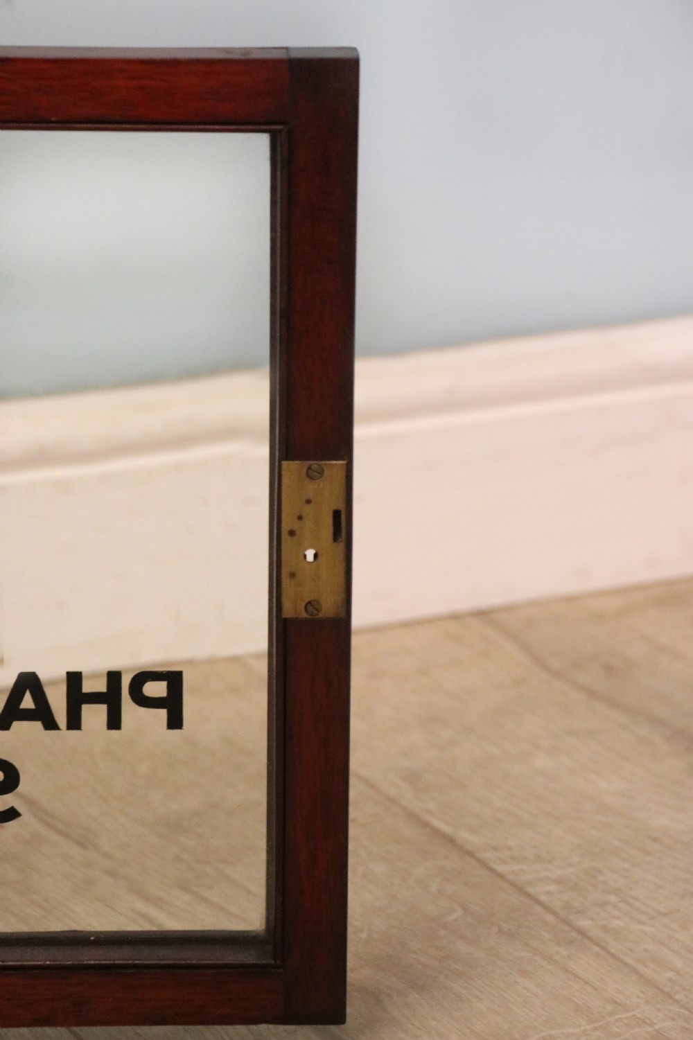A stylish vintage apothecary cabinet by the renowned furniture makers Edwards & Roberts.  View XXII