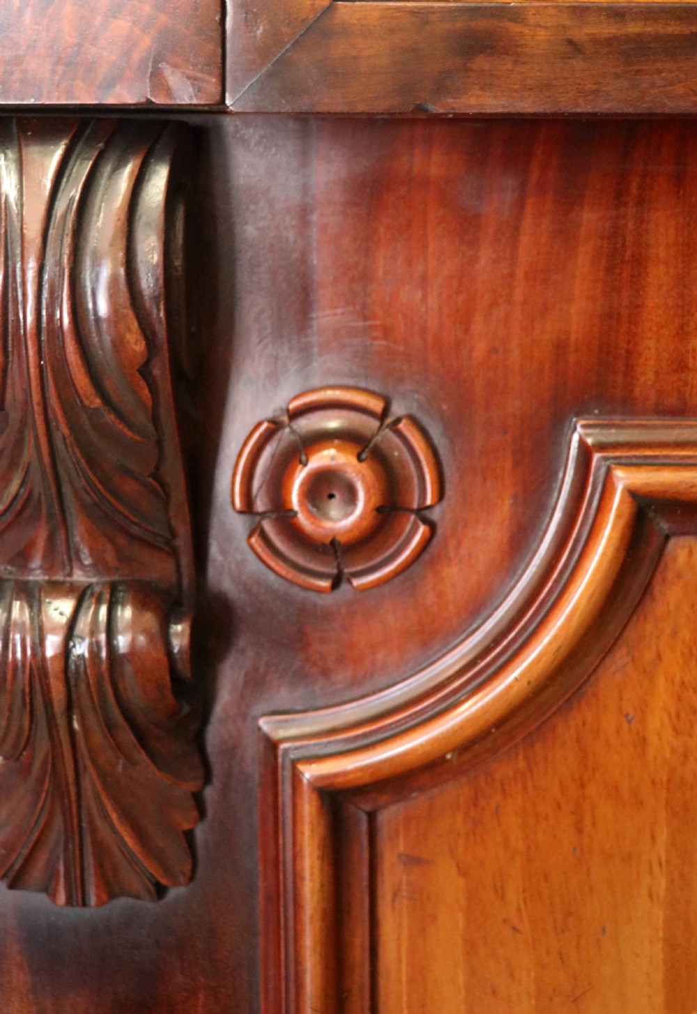A Victorian mahogany two-height glazed bookcase featuring gilt advertising lettering on the glass doors and lower panelled doors. View XXVII