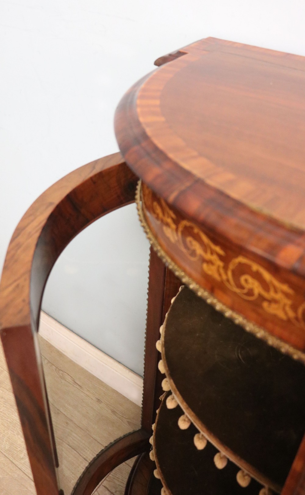 A Victorian walnut credenza featuring floral marquetry inlay, a central glazed door, two curved glass side doors, and gilt metal mounts. View XVII