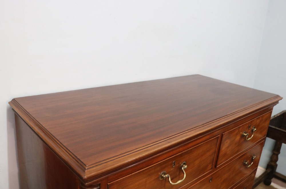 An absolutely delightful early 19th century mahogany chest of drawers. View XX