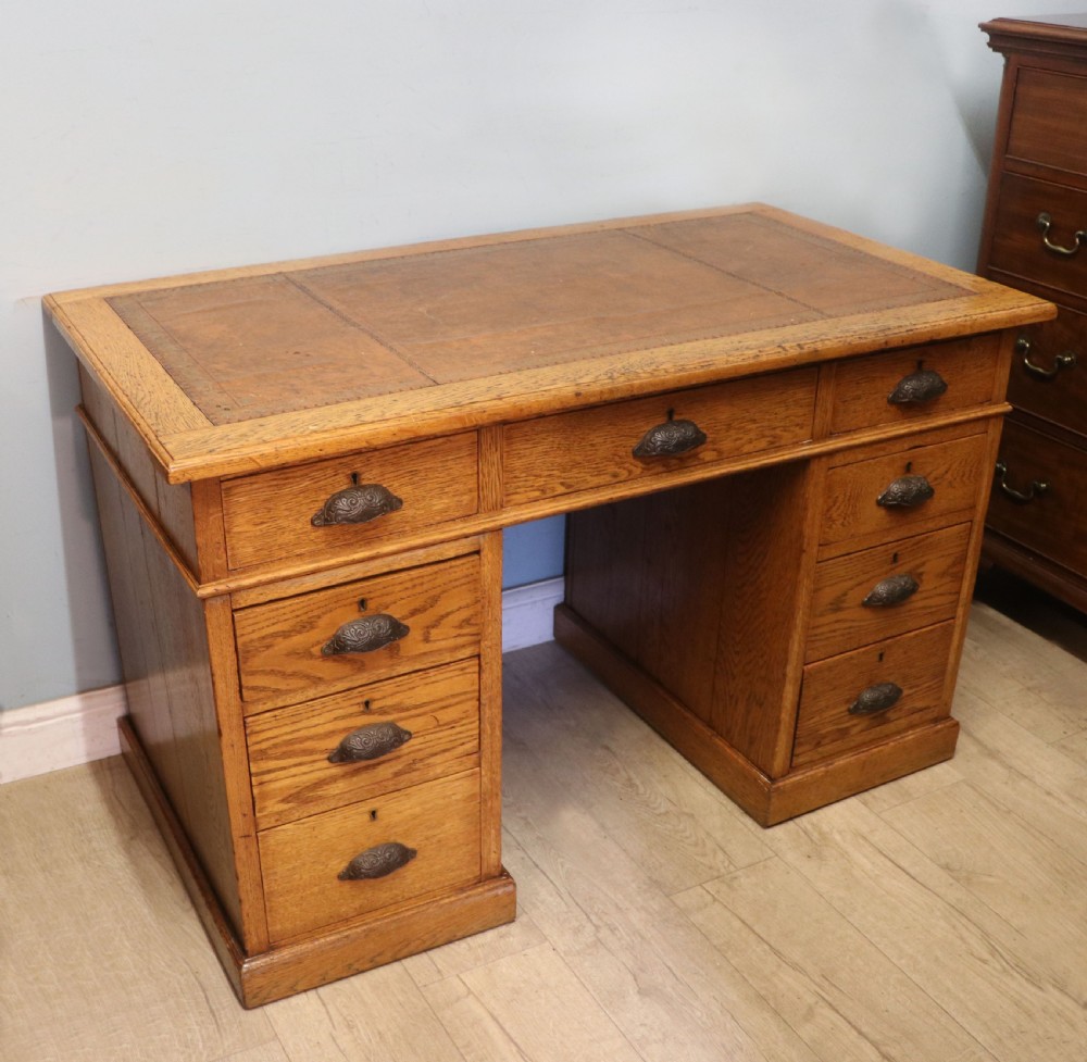Victorian quality! A lovely late 19th century light oak twin pedestal desk.  View II