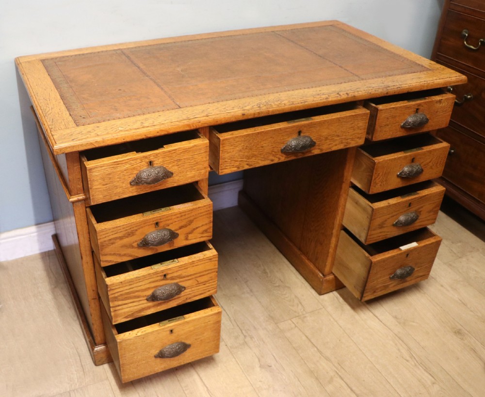 Victorian quality! A lovely late 19th century light oak twin pedestal desk.  View III